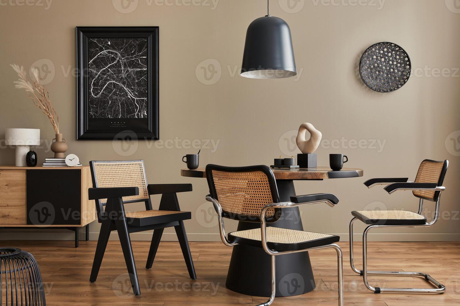 Modern composition of dining room interior with design wooden table, stylish chairs, cups, vessel, commode, black mock up poster map and elegant accessories in home decor. Template photo