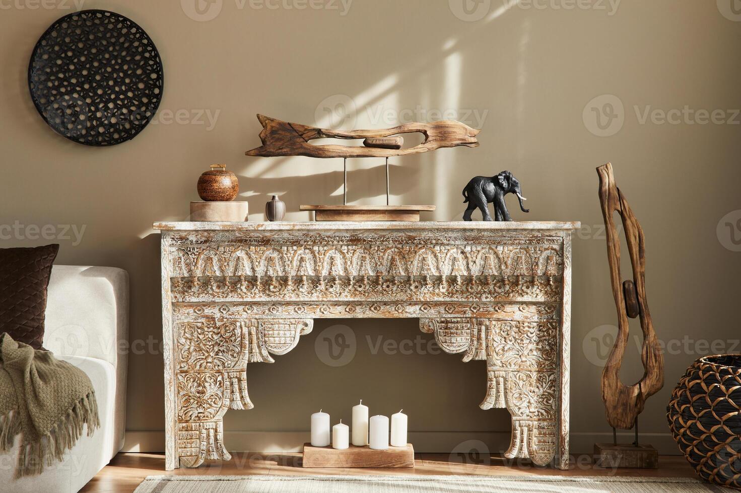 Modern concept of mediterranean interior with design shelf, wooden stool, art paintings, carpet and personal accessories in stylish home decor. photo