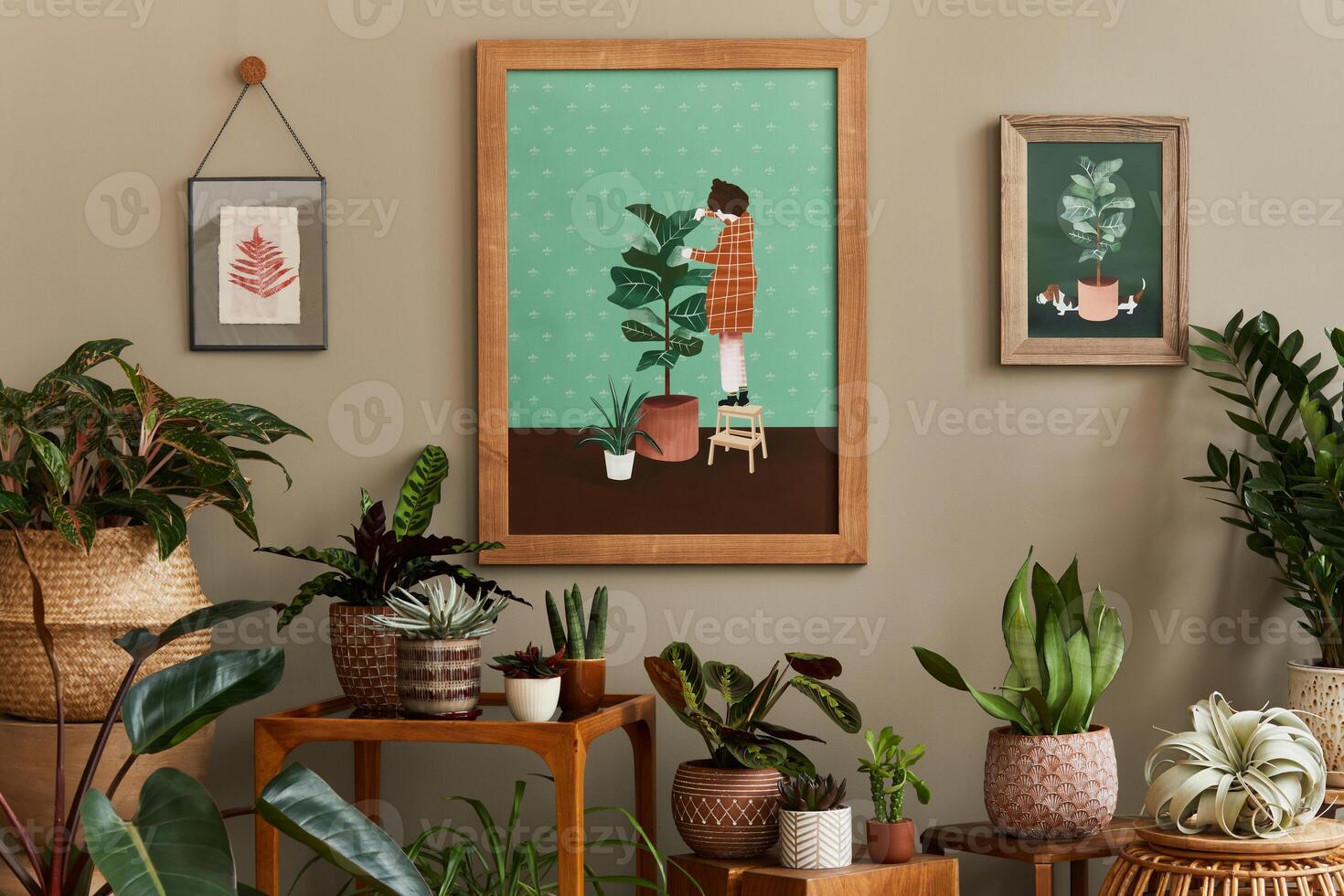 Stylish botany composition of home garden interior with mock up poster frame, filled a lot of beautiful house plants, cacti, succulents in different design pots and floral accessories. photo