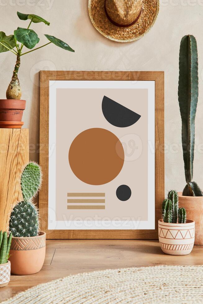 Creative composition of stylish living room with poster frame, cacti and personal accessories. Plant love and nature concept. photo