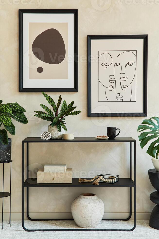 Creative composition of stylish modern living room interior with mock up poster frames, black geometric commode, plants and personal accessories. Neutral colors. Template. photo