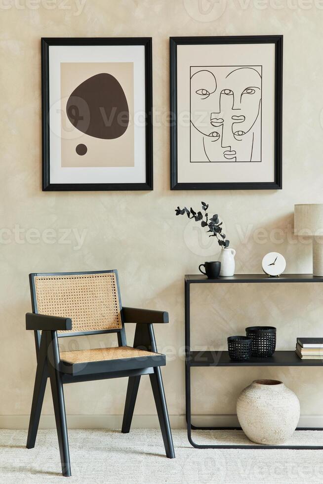 Creative composition of stylish modern living room interior with two mock up poster frames, black geometric commode, armchair and personal accessories. Neutral colors. photo