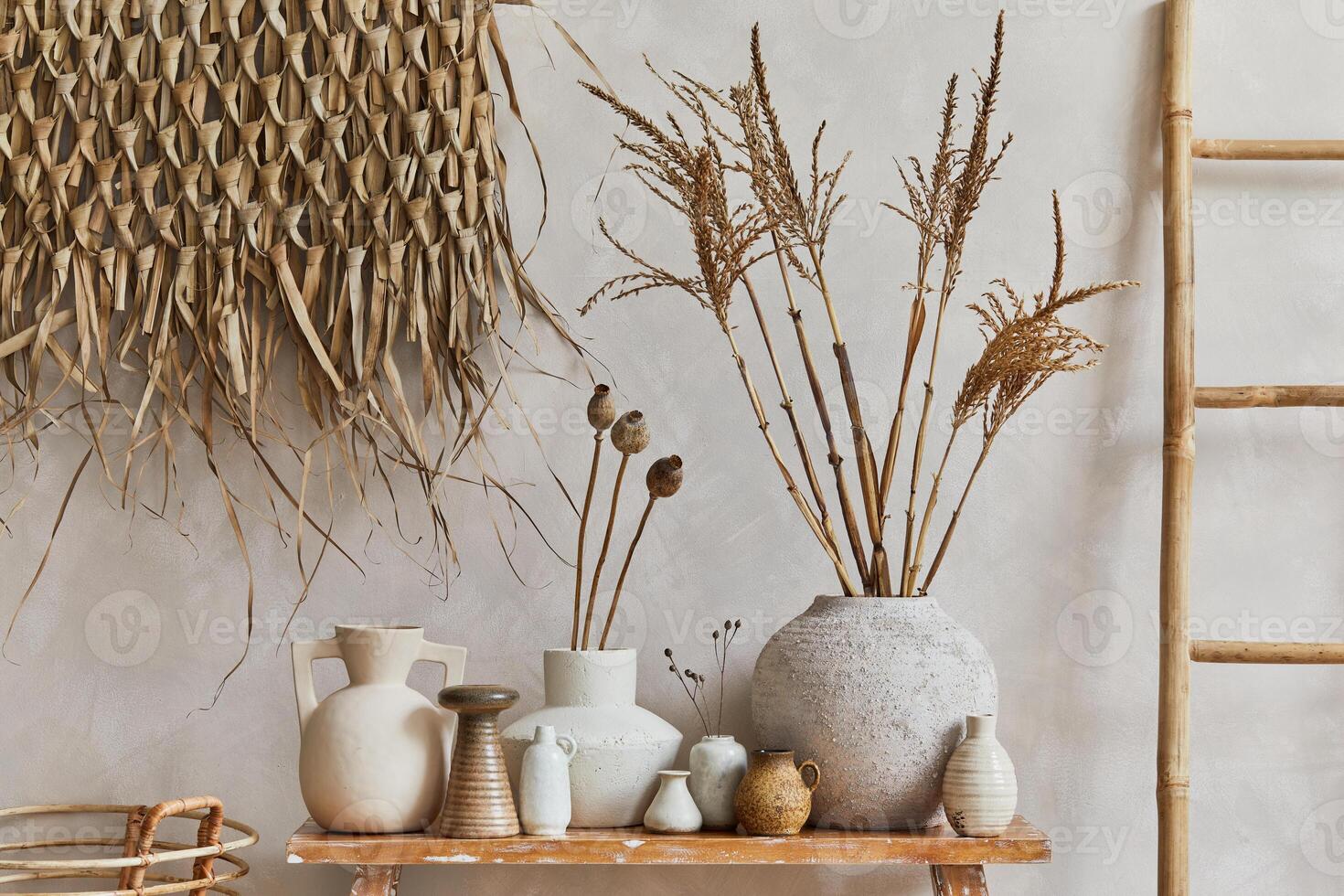 Stylish composition of living room interior with copy space, bench in retro style, clay vases and crockery. Rustic inspiration. Summer vibes. Template. photo