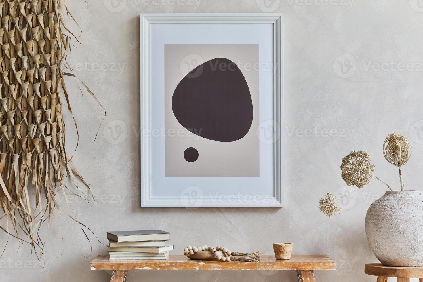 Stylish composition of cozy living room interior with mock up poster frame, bench in retro style, clay vases, crockery and straw decoration. Rustic inspiration. Summer vibes. Beige wall. Template. photo