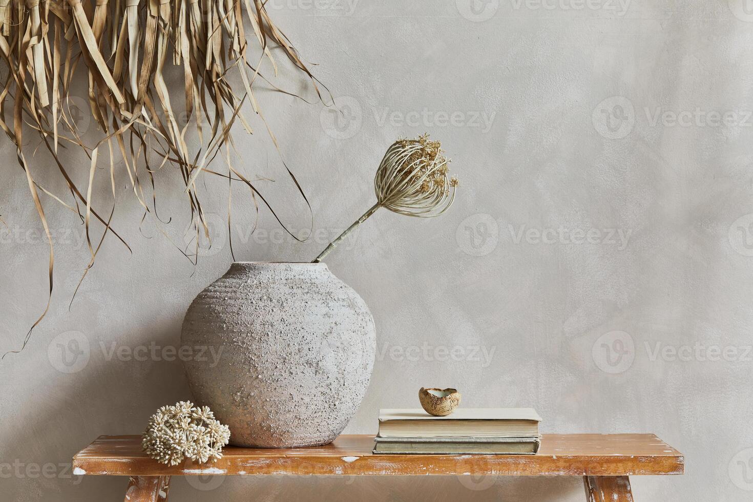 Stylish composition of living room interior with copy space, bench in retro style, clay vases and crockery. Rustic inspiration. Summer vibes. Beige wall. photo
