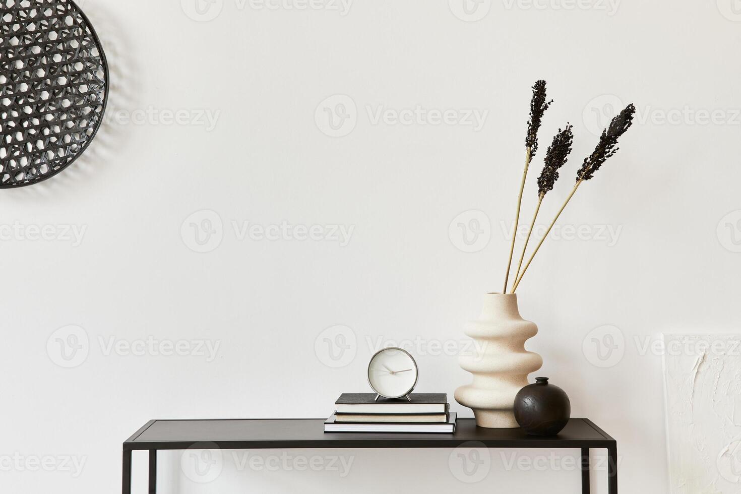 Minimalistic stylish interior composition of creative room, metal shelf, plants and personal accesories. Black and white concept. photo