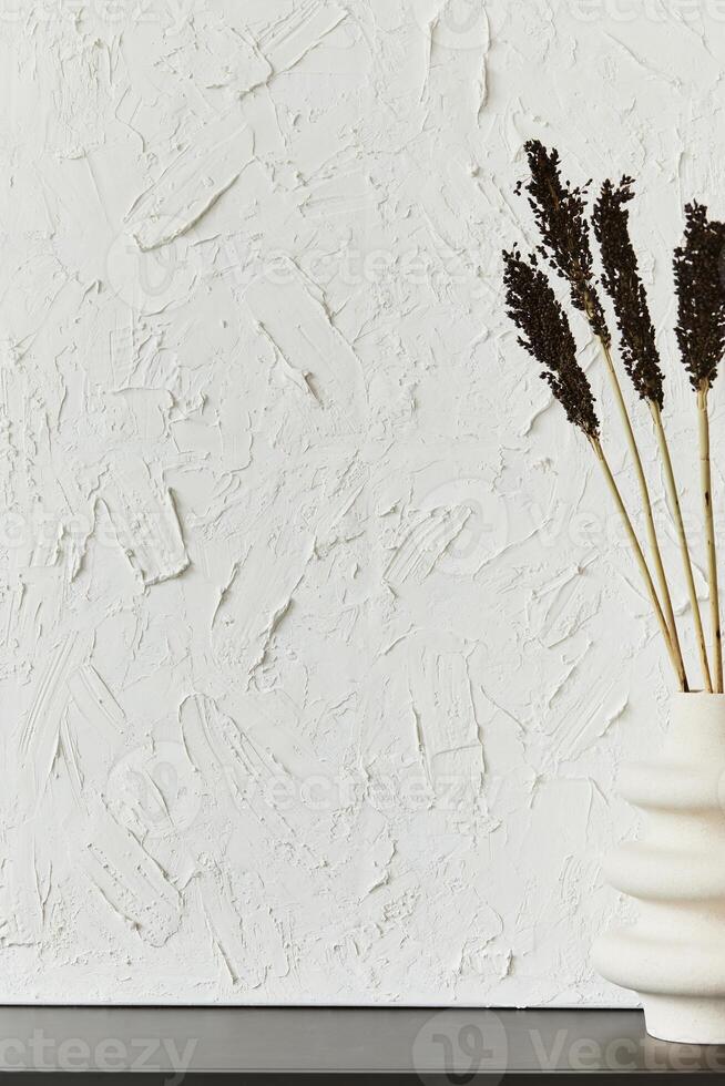 Stylish interior design composition of creative minimalisitc room with structure painting as copy space and personal accesories. Black and white. photo