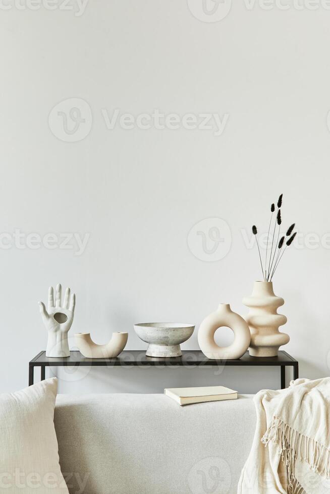 Stylish and cozy living room interior design composition with copy space, corner sofa, coffee table, textile and personal accessories. Scandinavian classic style. photo