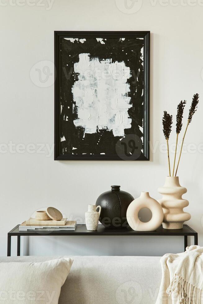 Stylish iving room interior design composition with mock up poster frame, corner sofa, coffee table, textile and personal accessories. Scandinavian classic style. . photo