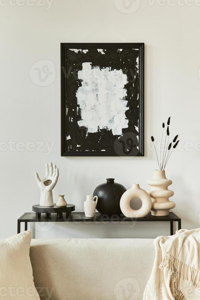 Stylish composition of creative living room interior design with mock up poster frame, corner sofa, coffee table, textile and personal accessories. Scandinavian classic style. photo