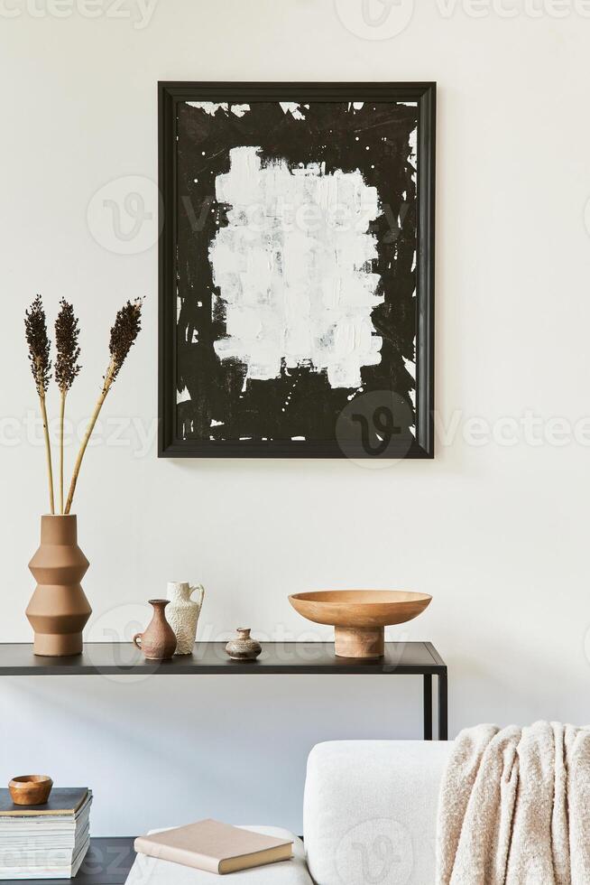 Creative composition of cozy living room interior design with mock up poster frame, corner sofa, coffee table, textile and personal accessories. Scandinavian classic style. Template. photo