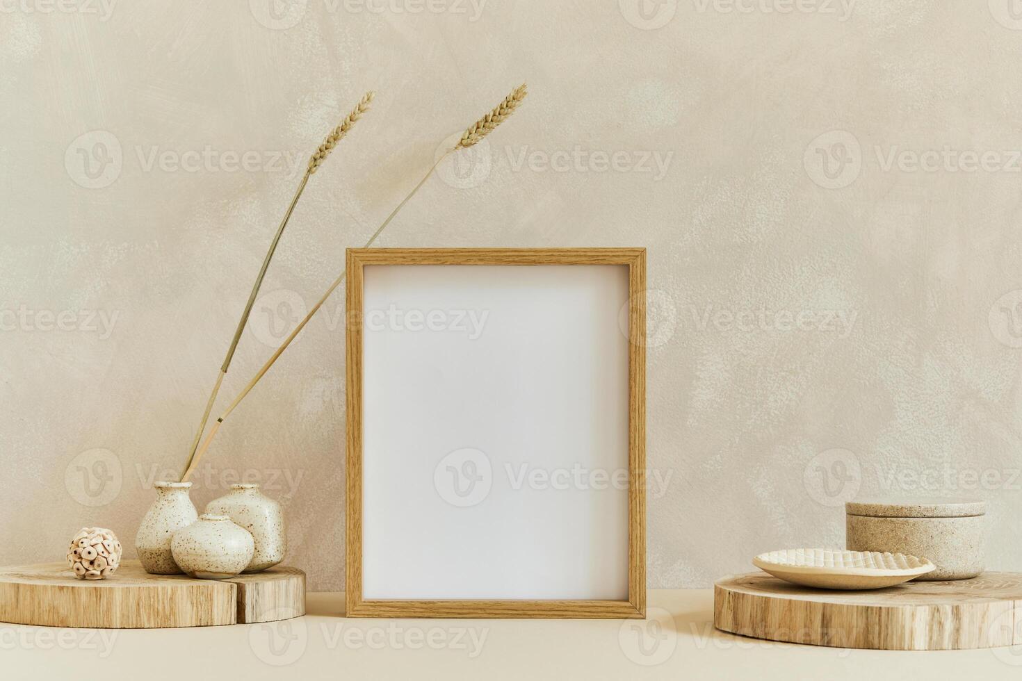 Stylish composition of cozy interior design with mock up poster frame, natural materials as wood and marbel, dry plants and personal accessories. Neutral colors, template. photo