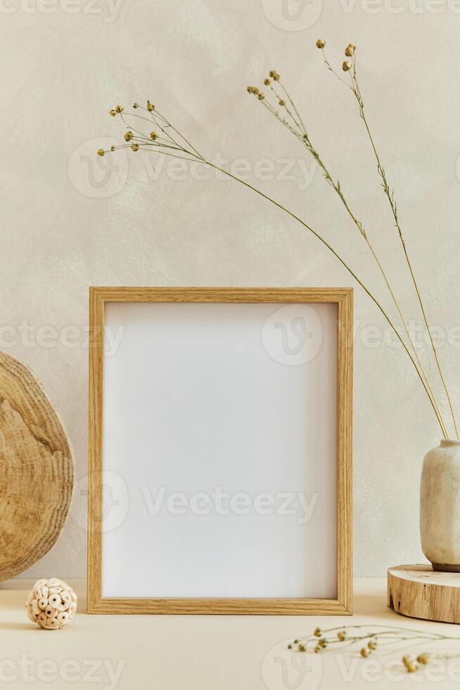Creative composition of cozy minimalistic interior design with mock up poster frame, natural materials as wood and marbel and personal accessories. Neutral beige colors, template. photo