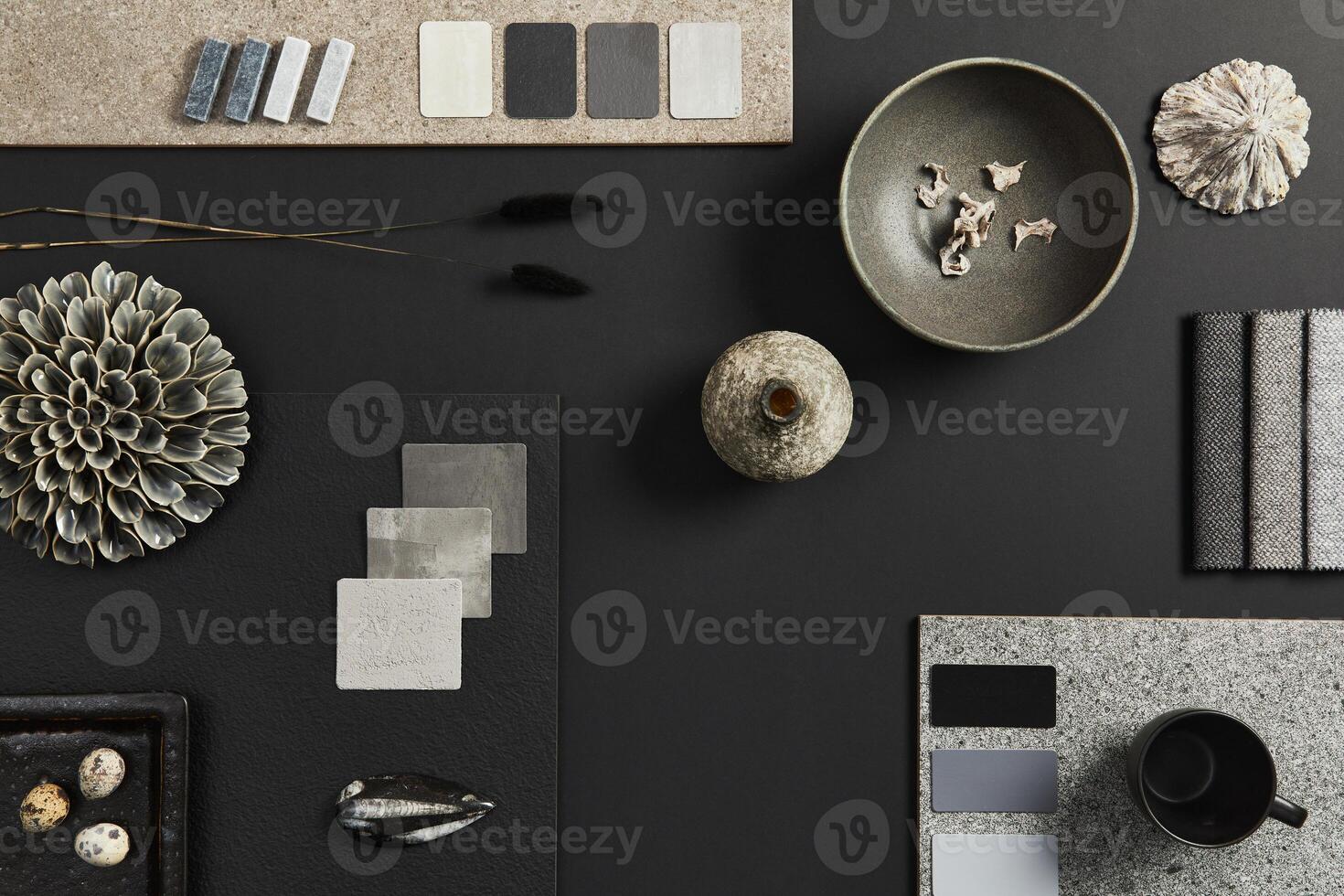 Flat lay composition of creative black architect moodboard with samples of building, textile and natural materials and personal accessories. Top view, black backgroung, template. photo