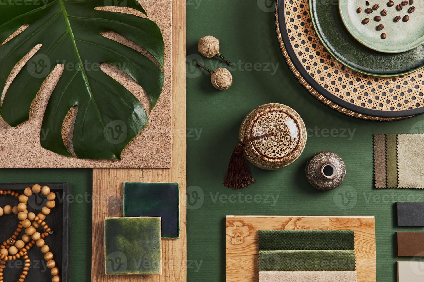 Stylish flat lay composition of creative architect moodboard design with samples of building, textile and natural materials and personal accessories. Top view, green background, template. photo
