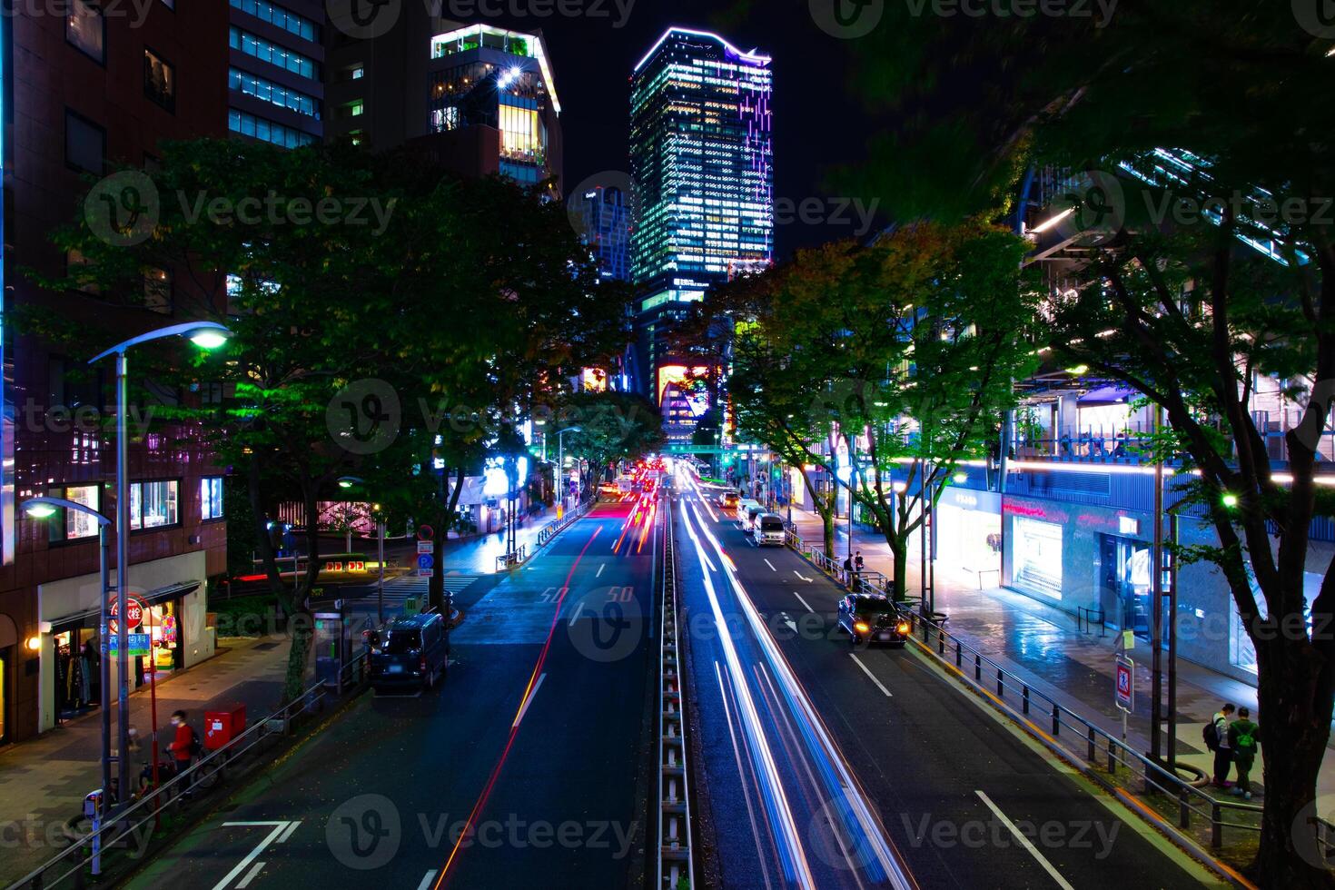 A night neon street in Shibuya wide shot photo