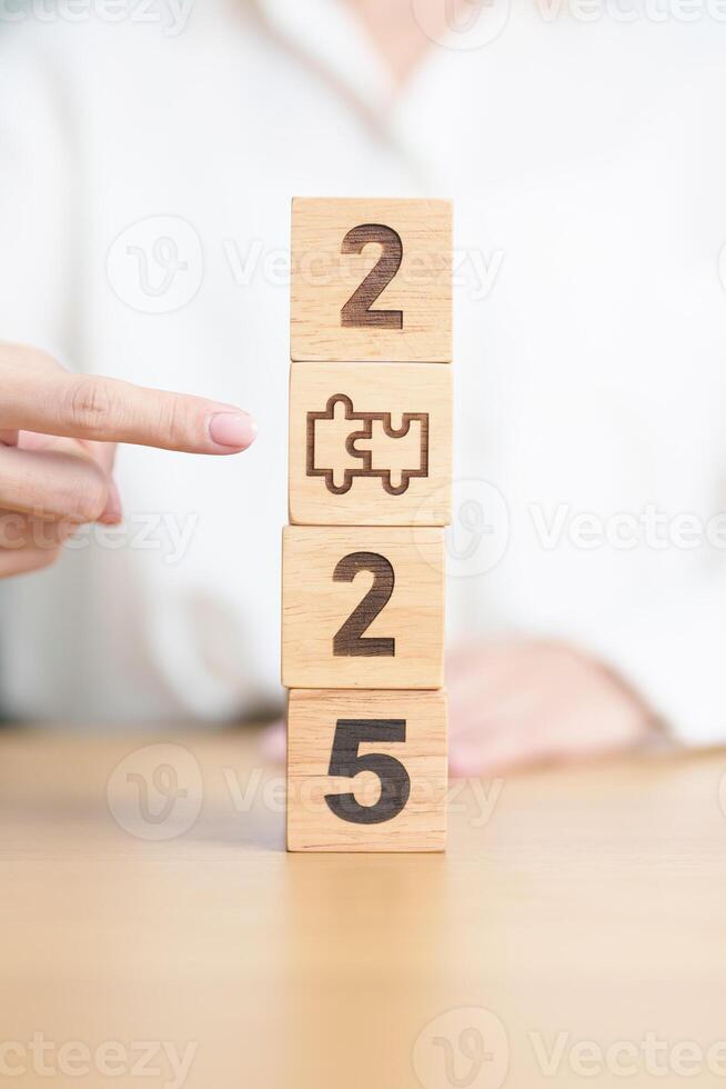 2025 block with jigsaw puzzle icon. Business Process, Team, teamwork, Goal, mission, Resolution, strategy, plan, Action, partnership, and New Year start photo