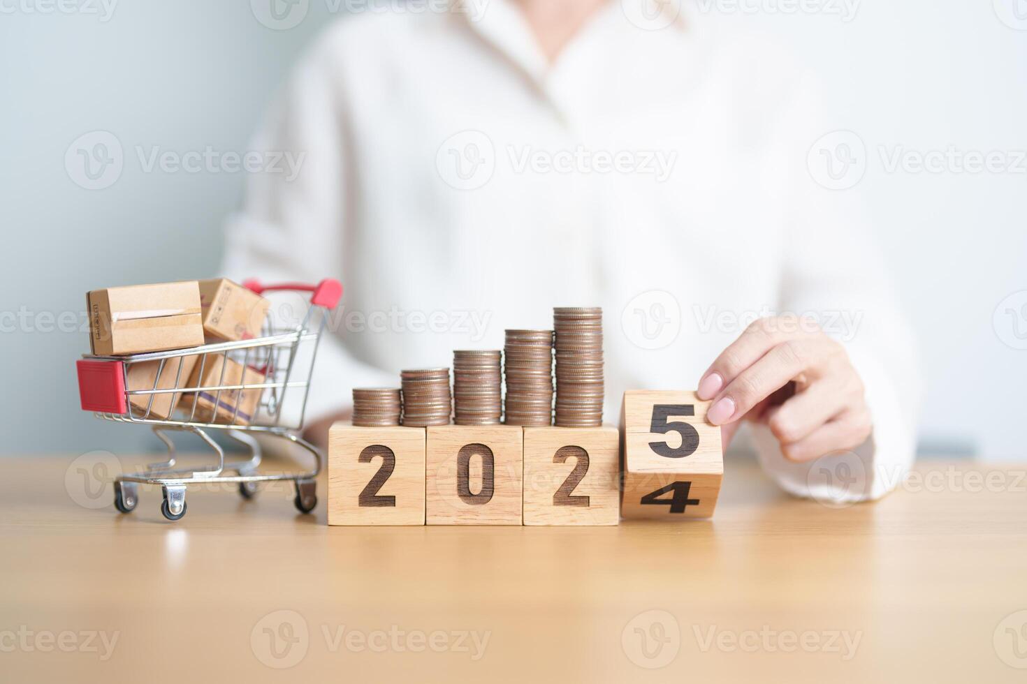 2024 end year to Happy New Year 2025 with shopping cart and money coins stack. online shopping, Marketplace platform website, technology, ecommerce, shipping delivery, logistics and online payment photo