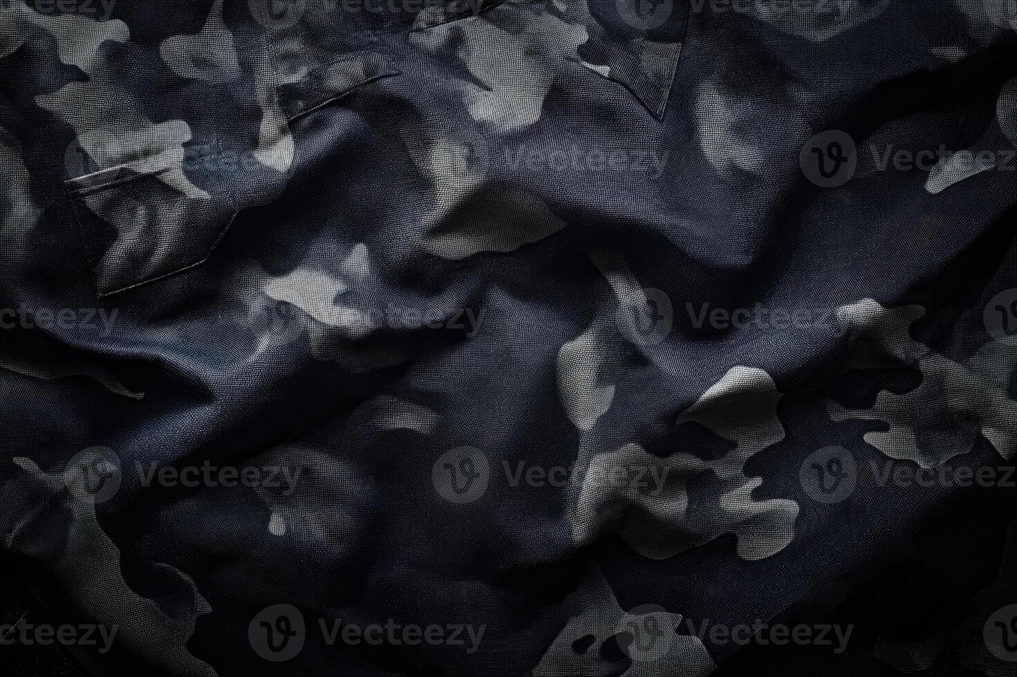 Black and white camouflage fabric is lying in folds photo