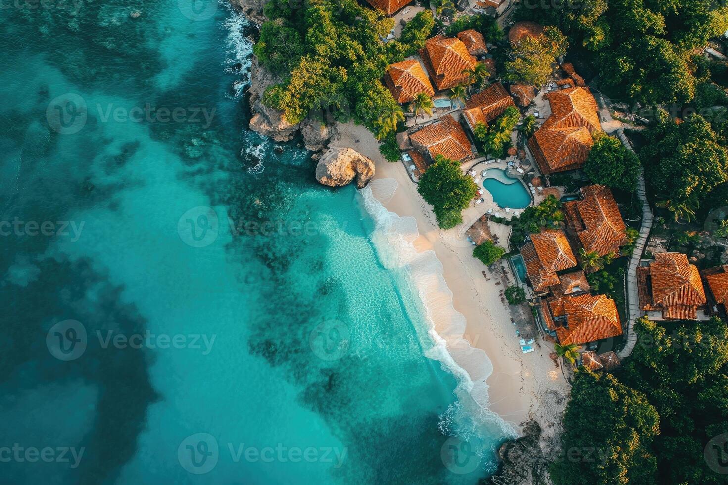Turquoise ocean water lapping on the shore of a tropical resort island photo