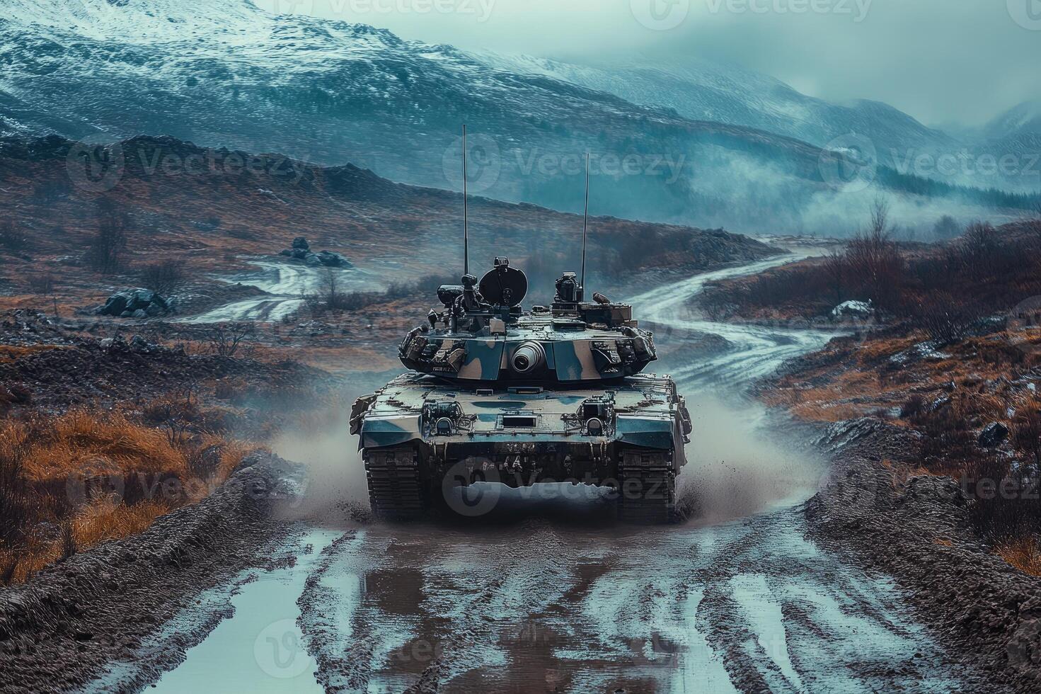 Military tank driving on muddy road in mountains photo