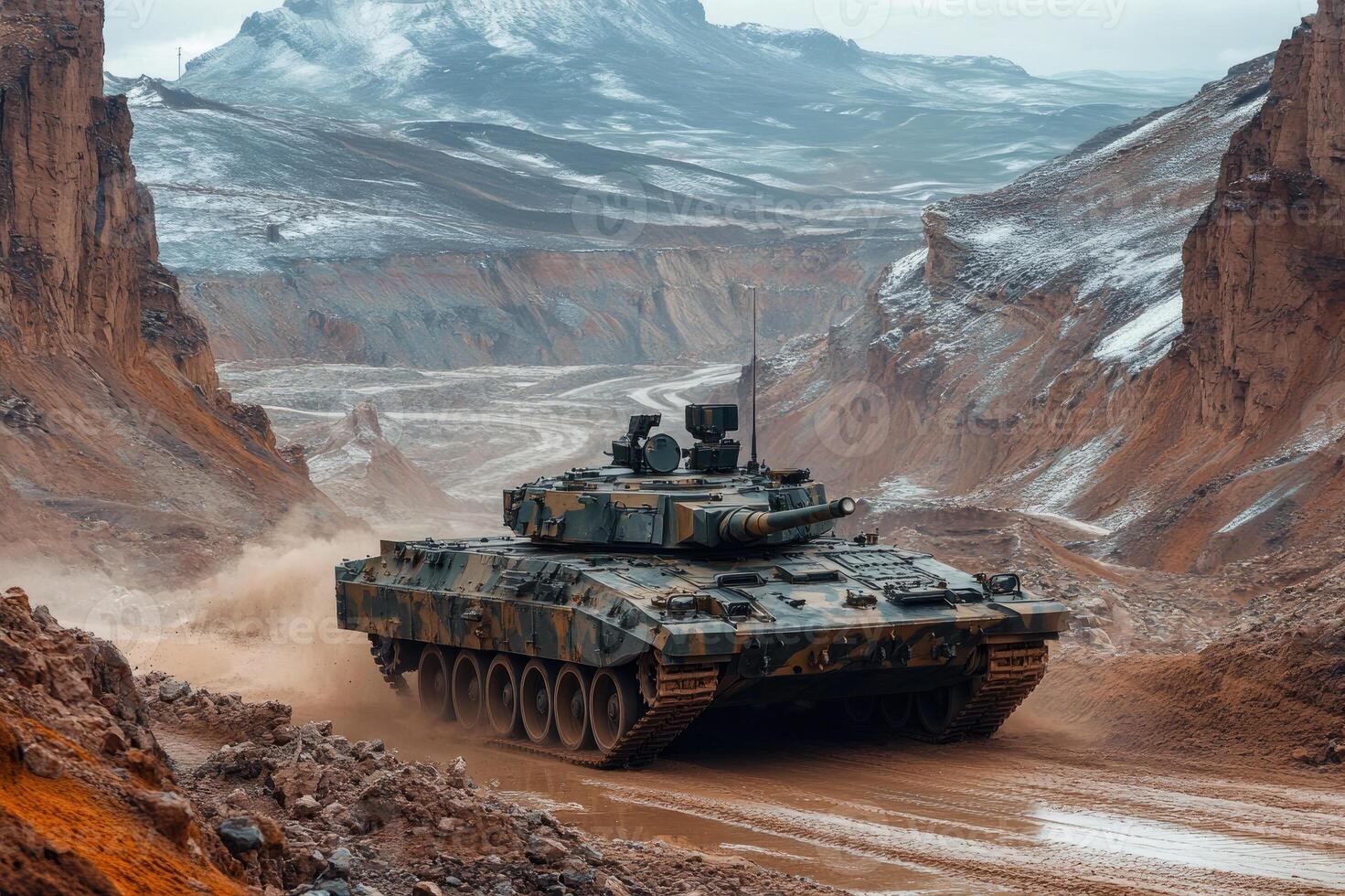 Modern battle tank driving through mountain pass photo