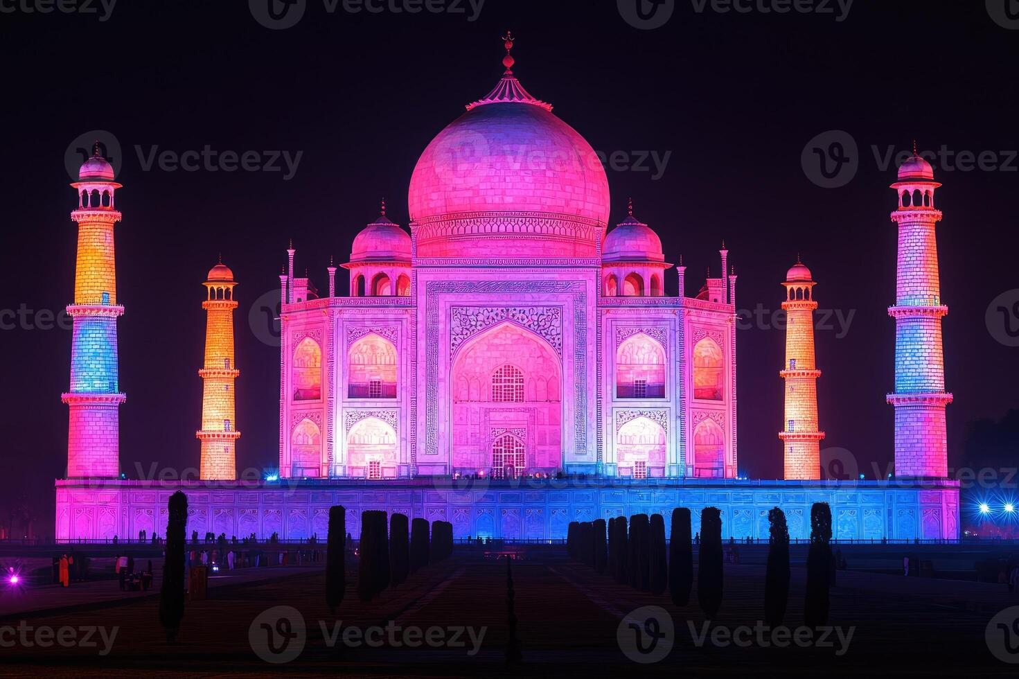 Taj mahal illuminated with vibrant colors at night in india photo