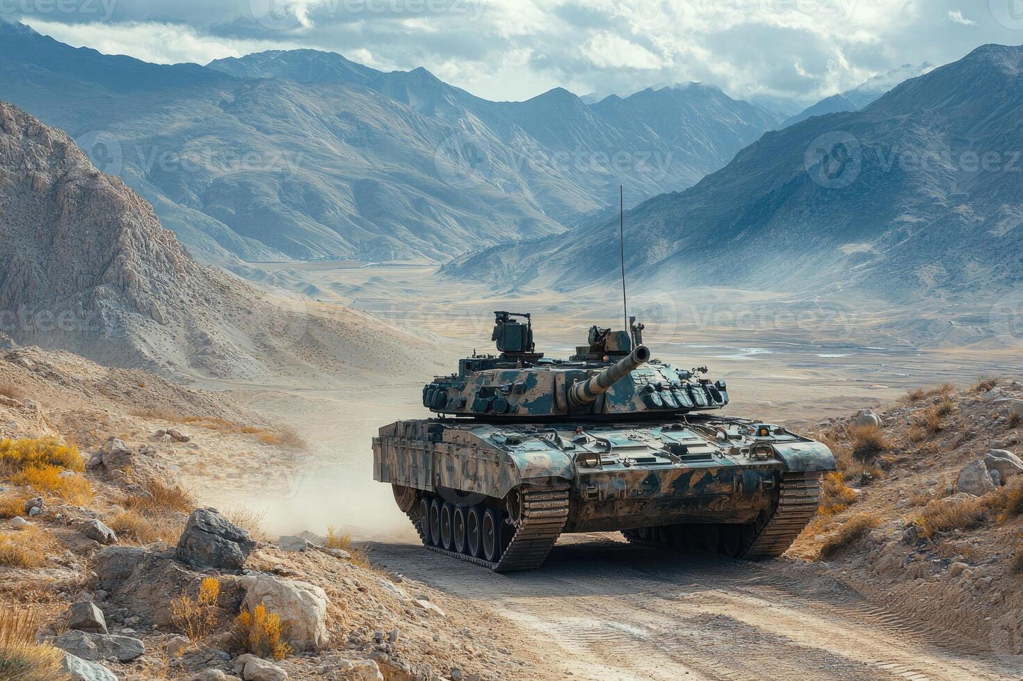 Modern battle tank driving in desert mountain terrain photo