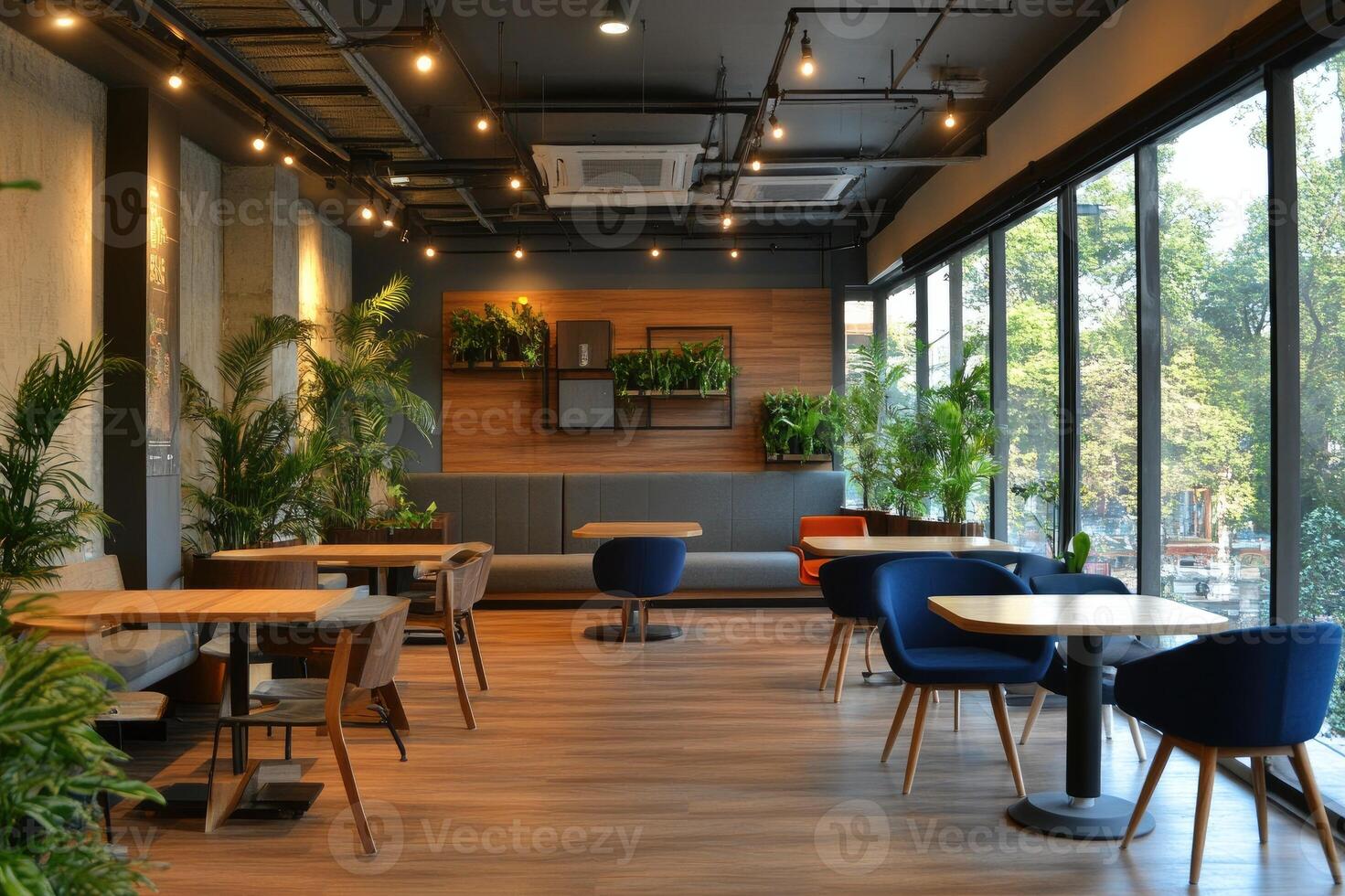 Modern cafe interior with wooden furniture and green plants photo