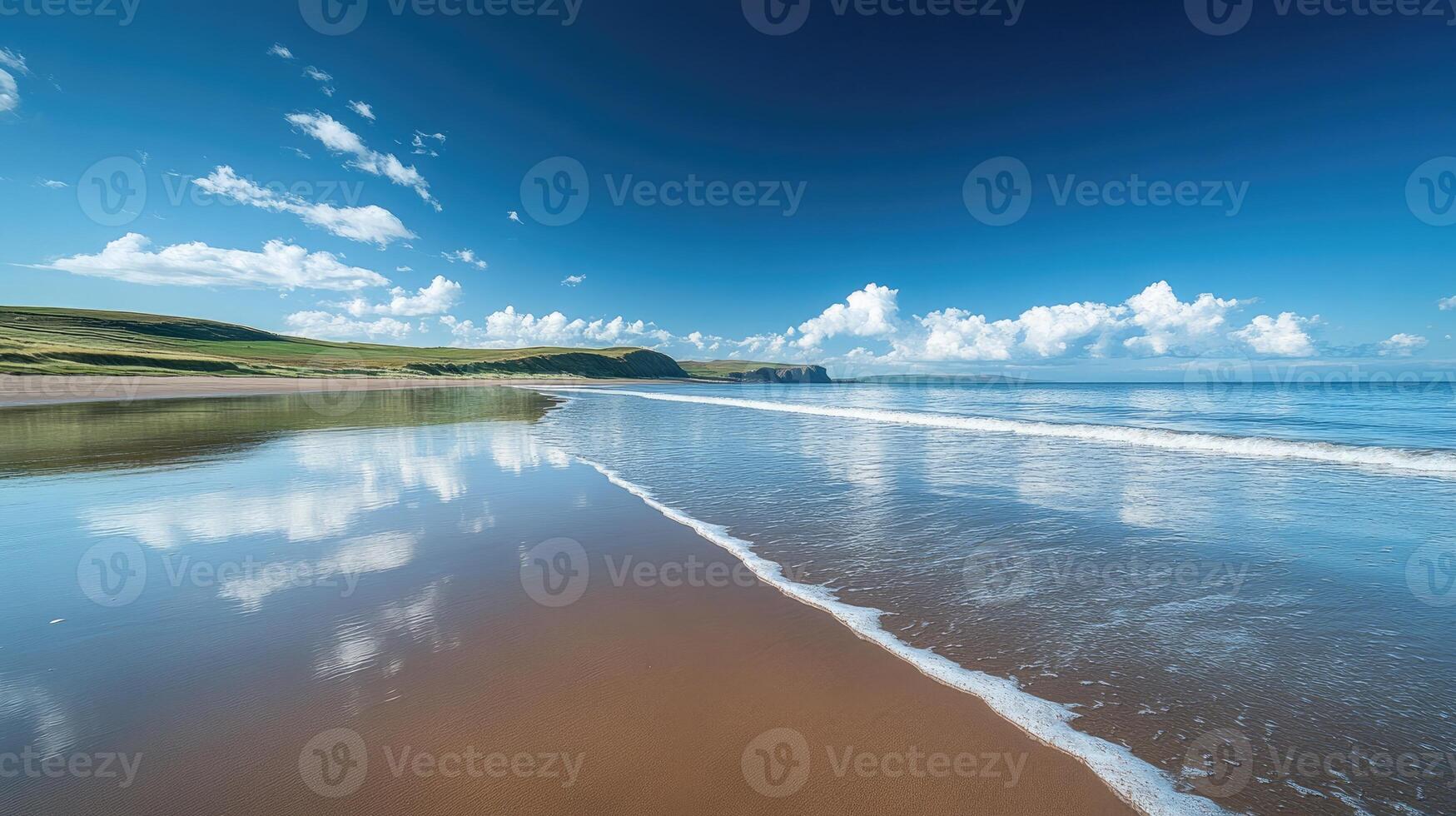 White clouds reflecting on wet beach sand on sunny day photo