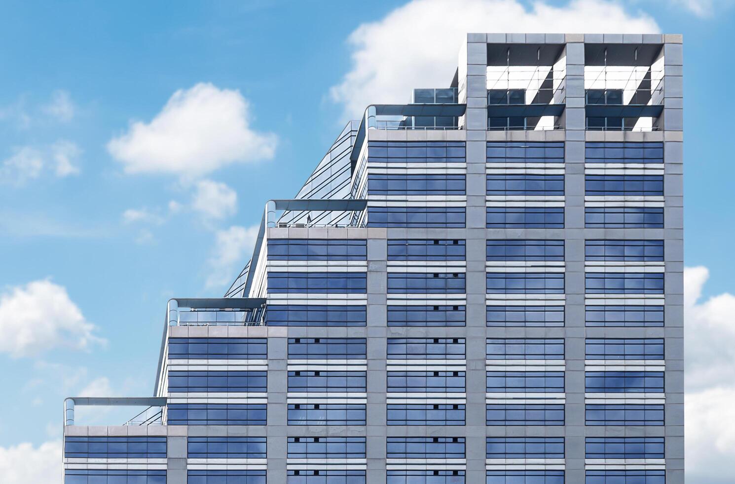 Modern office building with blue sky background photo