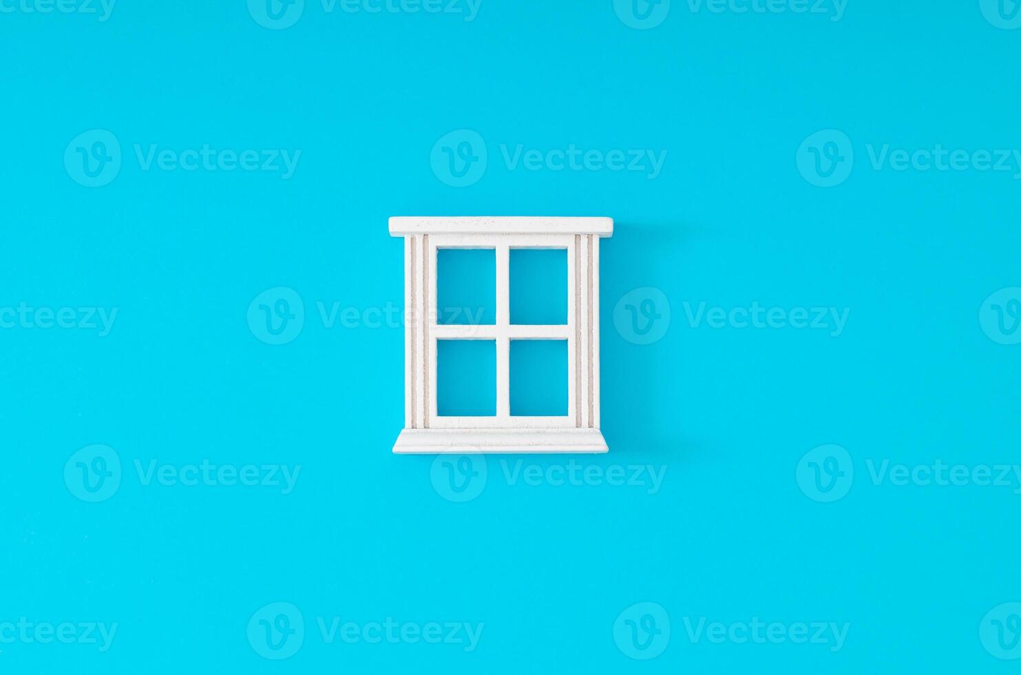 White window frame on light blue background. Minimal concept and simplicity. Flat lay. photo