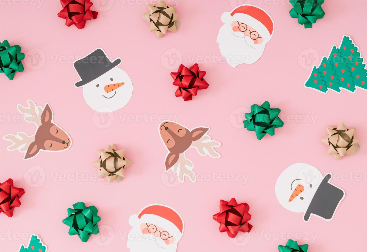 Creative Christmas pattern made of various Xmas objects on pastel pink background. Minimal Christmas and New Year concept. Creative festive holiday pattern backdrop. Flat lay, top of view. photo