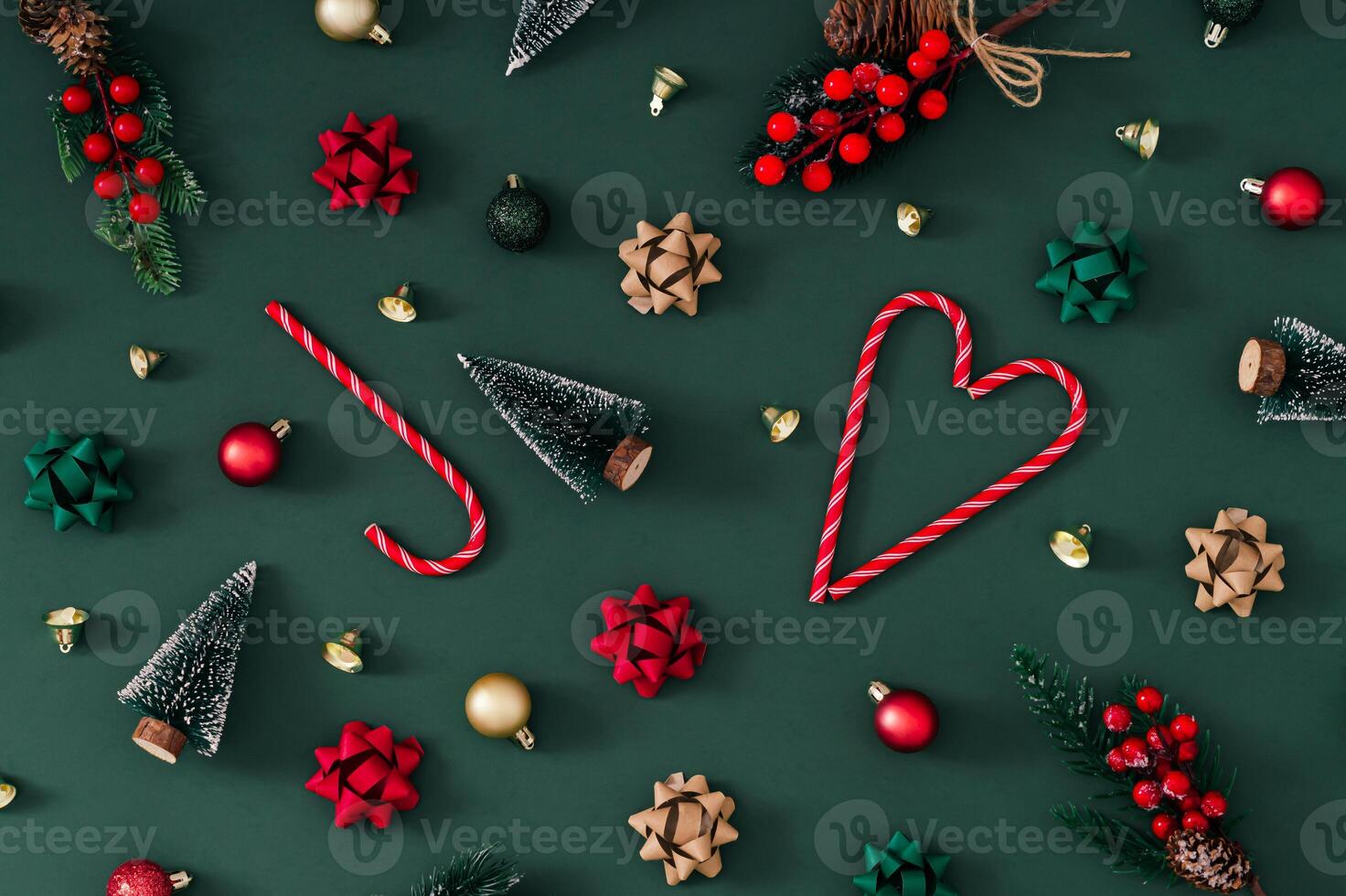 Trendy Christmas pattern made of various winter and Xmas objects on green background. Minimal creative Christmas and New Year concept. Festive holiday pattern backdrop. Christmas aesthetic. Flat lay. photo