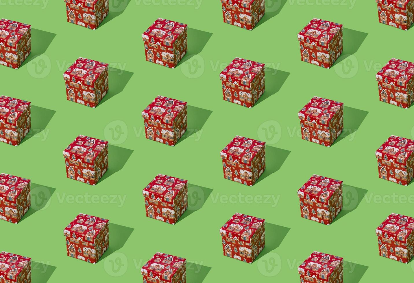 Trendy pattern composition made with red Christmas gift box on light green background. Minimal creative Christmas and New Year concept. Festive holiday pattern backdrop. Xmas aesthetic. photo