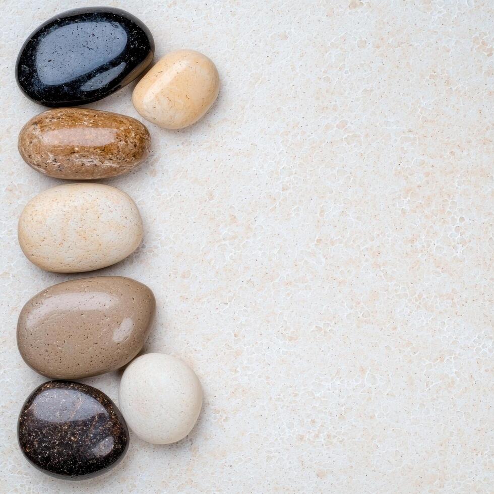 Assortment of smooth river stones on light background photo