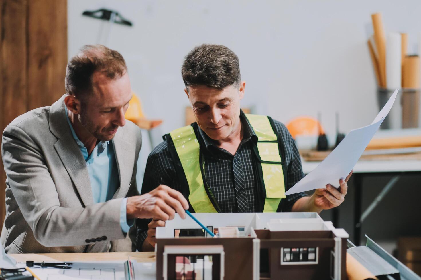 Team Engineers with draft plan of building on constructing site. Engineer work on site. engineer visit and inspection site engineer. Inspector engineer check and working on site. photo