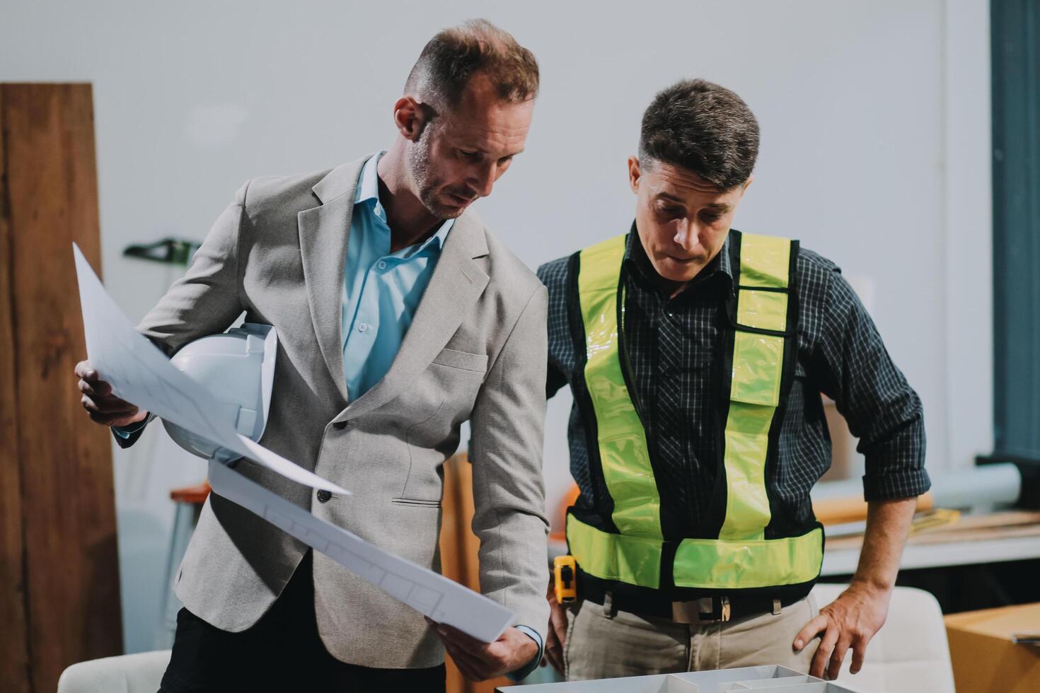 Team Engineers with draft plan of building on constructing site. Engineer work on site. engineer visit and inspection site engineer. Inspector engineer check and working on site. photo