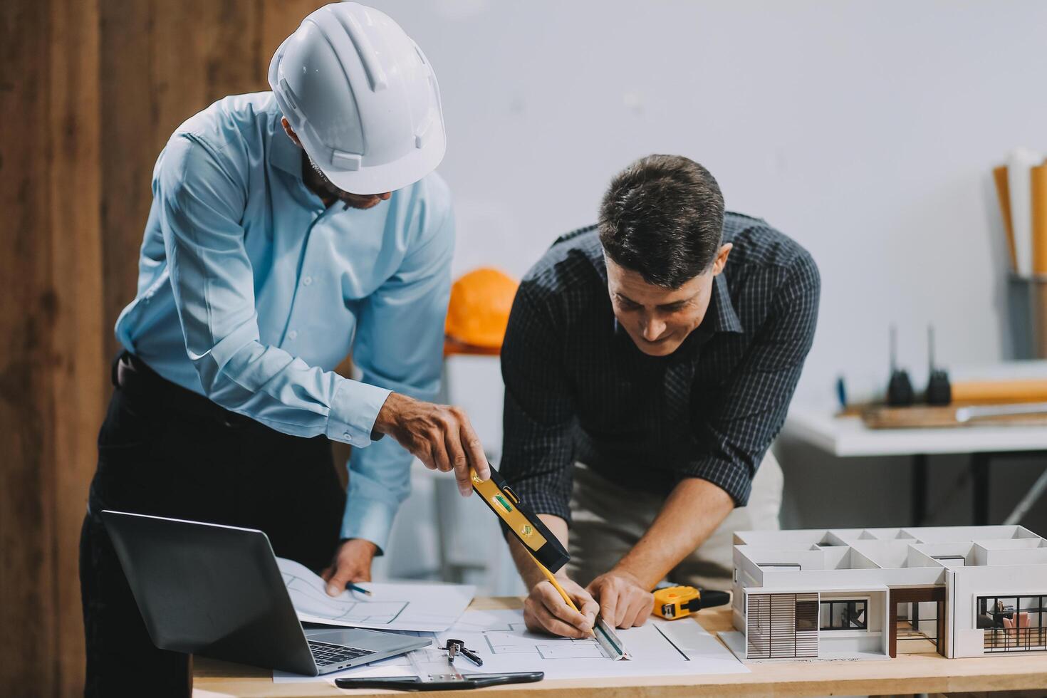 Team Engineers with draft plan of building on constructing site. Engineer work on site. engineer visit and inspection site engineer. Inspector engineer check and working on site. photo