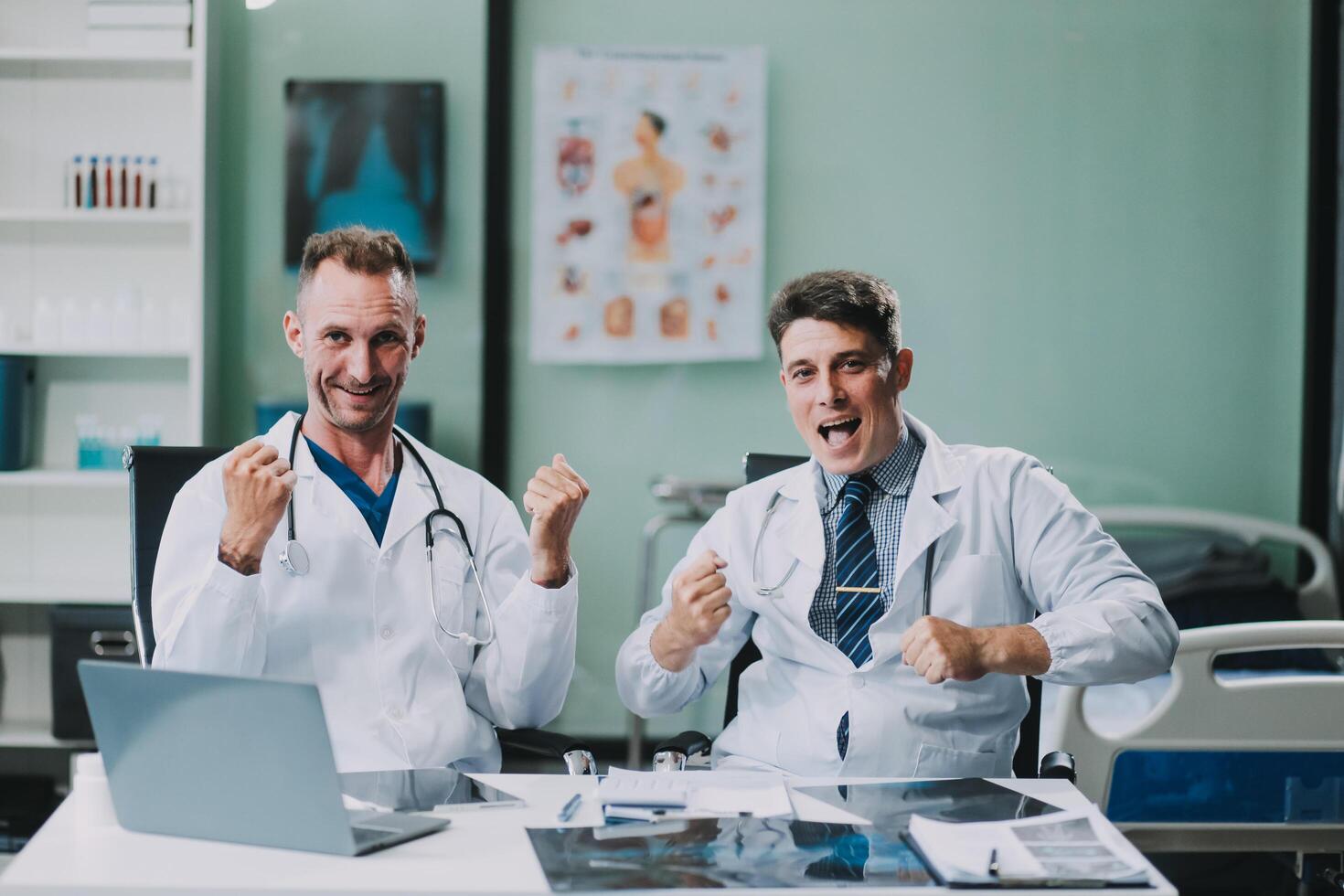 Smiling young male clinician shake hands with happy teammate appreciate for assistance on surgery show support respect on team council. Two doctors partners handshaking making deal reaching agreement photo