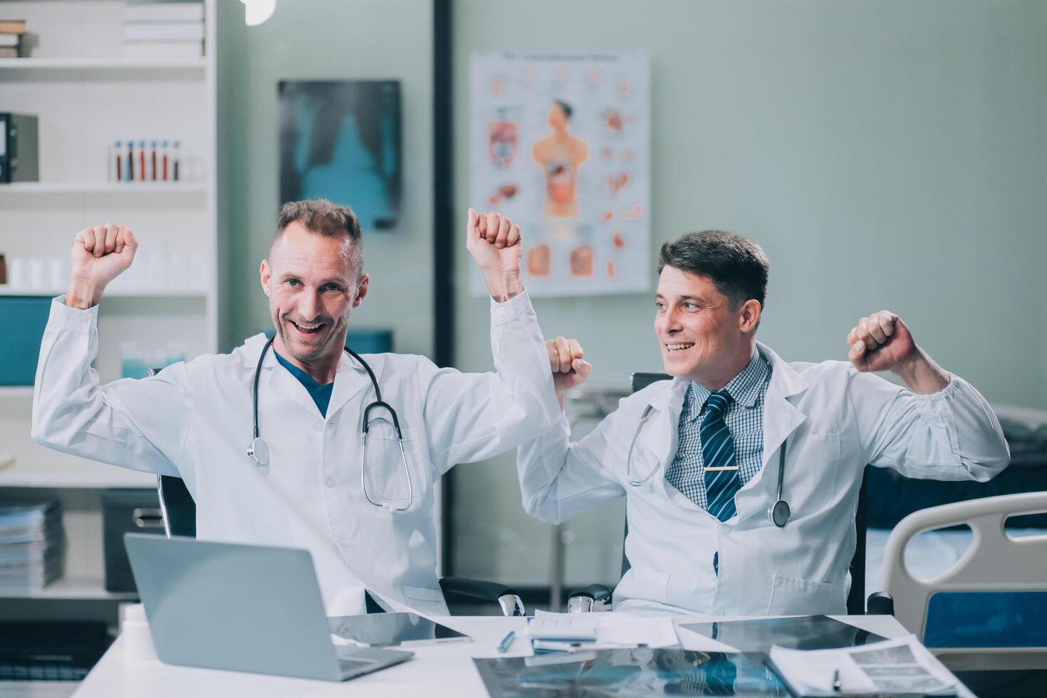 Smiling young male clinician shake hands with happy teammate appreciate for assistance on surgery show support respect on team council. Two doctors partners handshaking making deal reaching agreement photo
