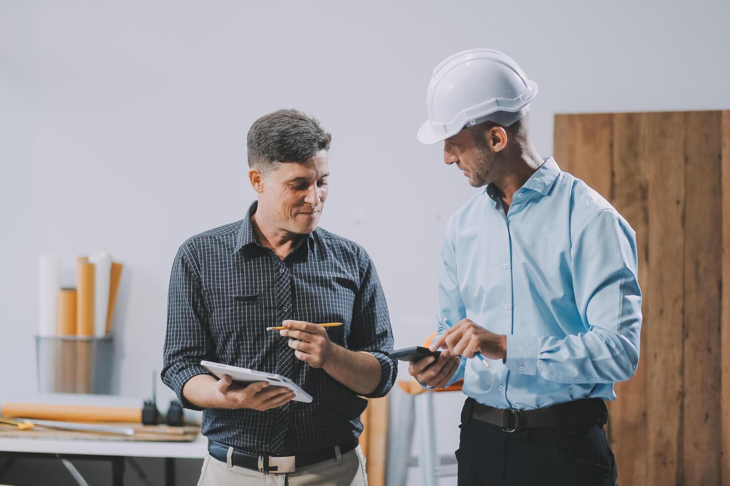 Team Engineers with draft plan of building on constructing site. Engineer work on site. engineer visit and inspection site engineer. Inspector engineer check and working on site. photo