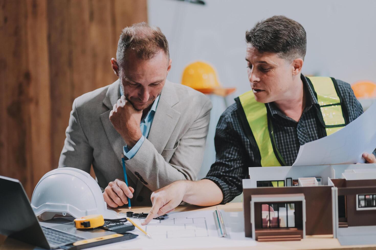 Team Engineers with draft plan of building on constructing site. Engineer work on site. engineer visit and inspection site engineer. Inspector engineer check and working on site. photo