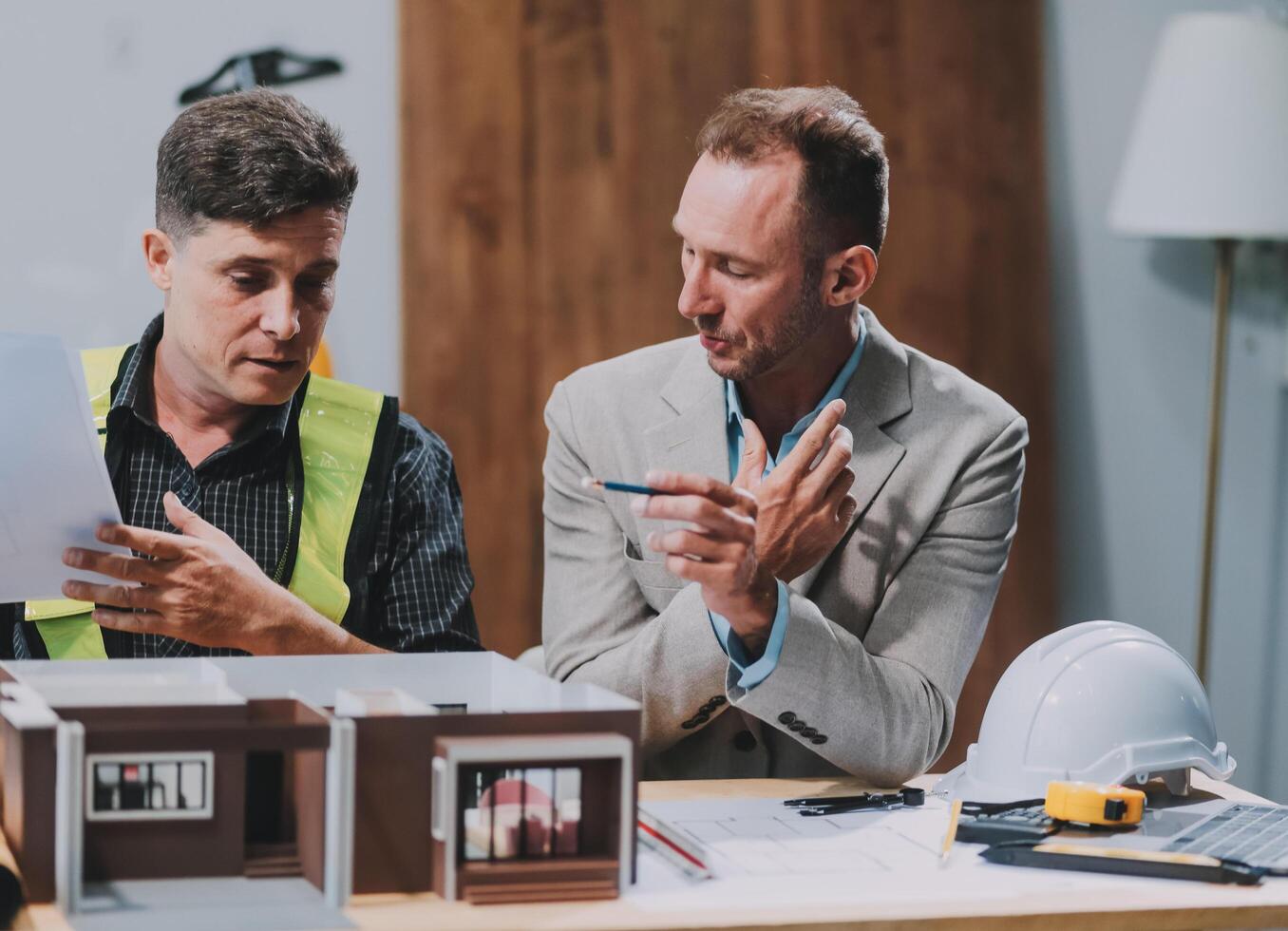 Team Engineers with draft plan of building on constructing site. Engineer work on site. engineer visit and inspection site engineer. Inspector engineer check and working on site. photo