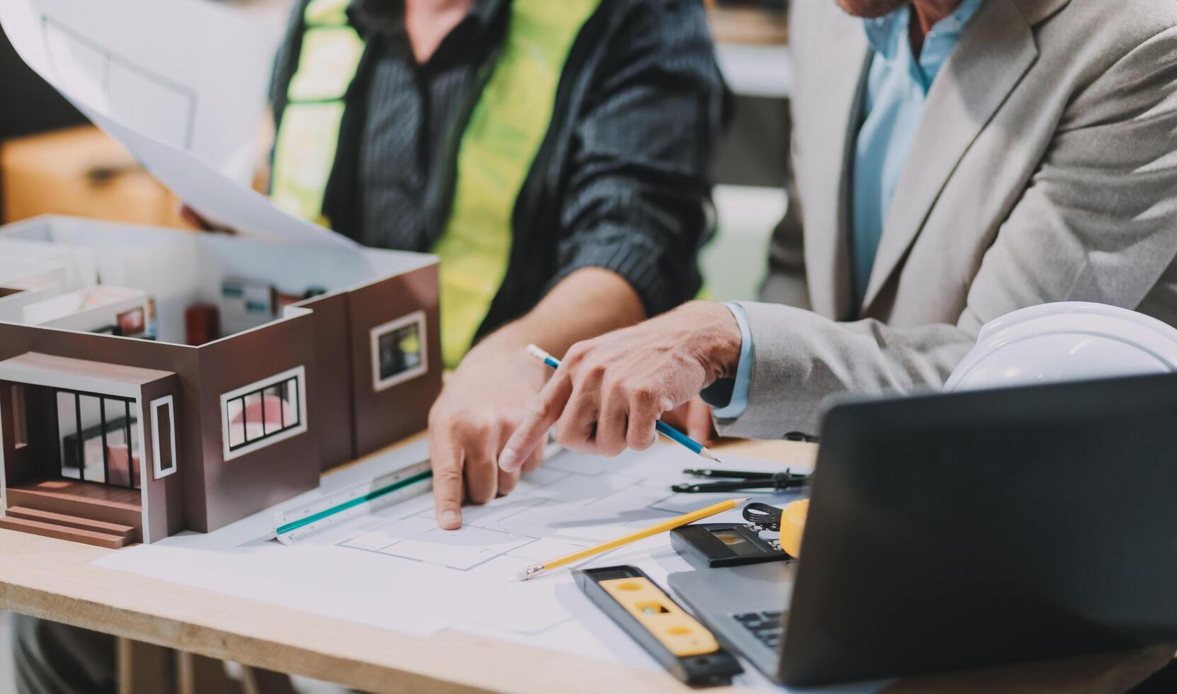 Team Engineers with draft plan of building on constructing site. Engineer work on site. engineer visit and inspection site engineer. Inspector engineer check and working on site. photo
