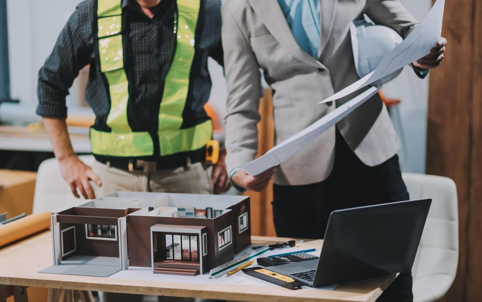 Team Engineers with draft plan of building on constructing site. Engineer work on site. engineer visit and inspection site engineer. Inspector engineer check and working on site. photo