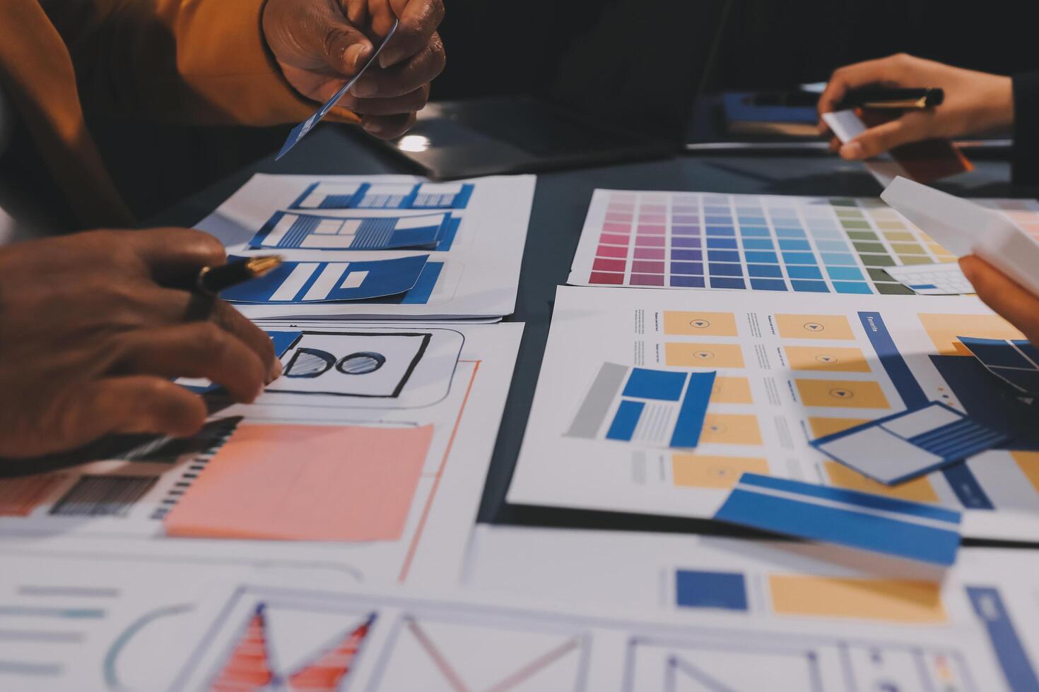 The designer team is designing the uxui system to make the uxui system work well on new phones and support system updates. Website development concept UI UX front end designer photo