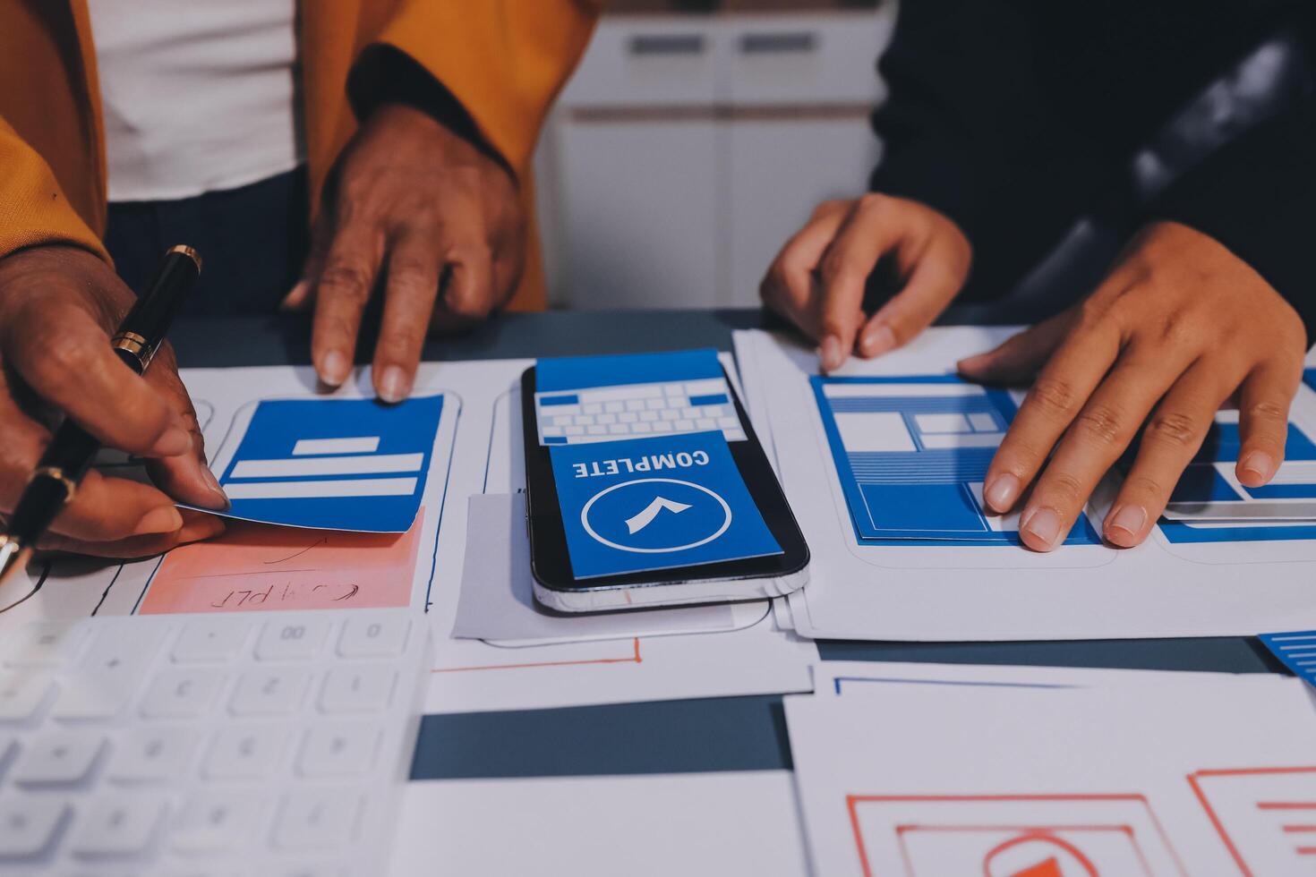 The designer team is designing the uxui system to make the uxui system work well on new phones and support system updates. Website development concept UI UX front end designer photo