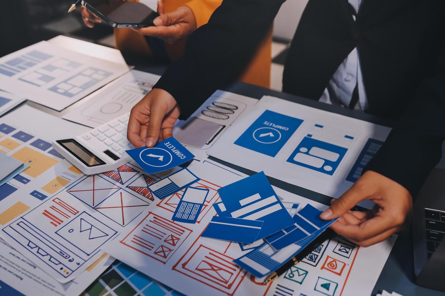 The designer team is designing the uxui system to make the uxui system work well on new phones and support system updates. Website development concept UI UX front end designer photo