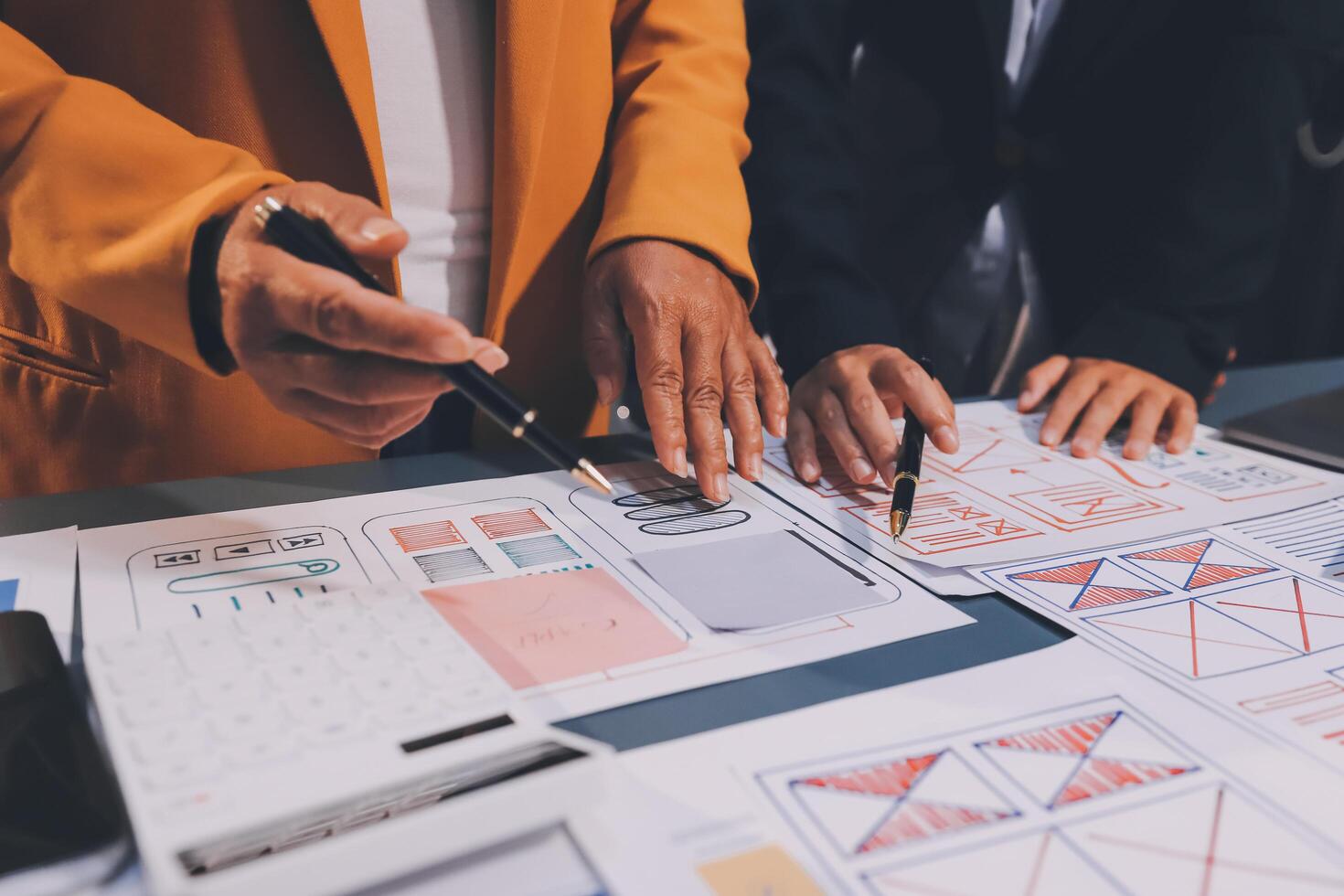 The designer team is designing the uxui system to make the uxui system work well on new phones and support system updates. Website development concept UI UX front end designer photo
